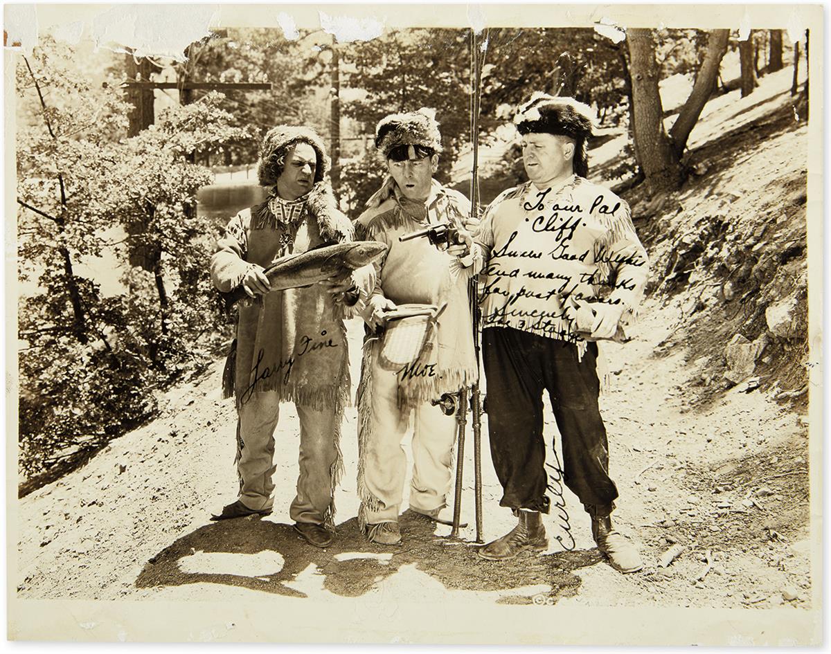 (THREE STOOGES, THE.) Photograph Signed, by each: Moe Howard (Moe), Jerry Howard (Curly), and Larry Fine (in full), and additionall